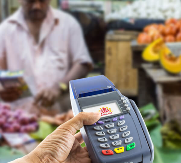 POS machine in a person's hand at a market in an African country